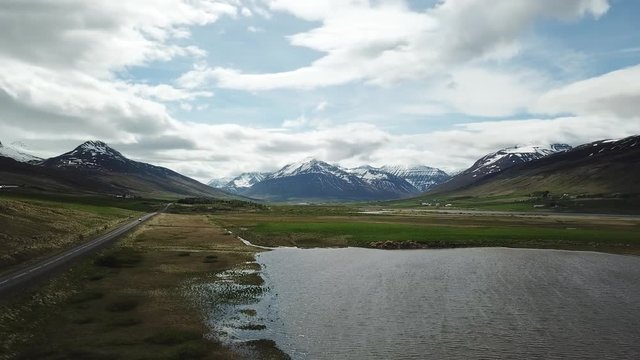 Small Lake and Mountains in Tr&ouml;llaskagi, Iceland - Panning Right