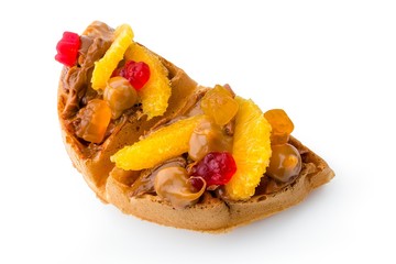 Belgium waffle with caramel, orange slices and gummy bears  isolated on white background