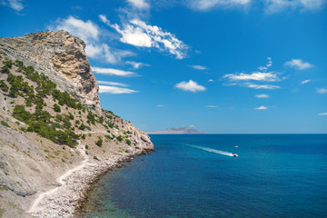 Fototapeta na wymiar Sea aerial view, Top view, amazing nature background.The color of the water and beautifully bright. Azure beach with rocky mountains and clear water of Crimea at sunny day.