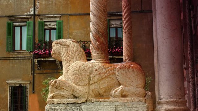 Detail of the lion and column in red marble of the Basilica of San Zeno in Verona Italy. Is considered one of the masterpieces of Romanesque architecture in Italy,ULTRA HD 4K, 