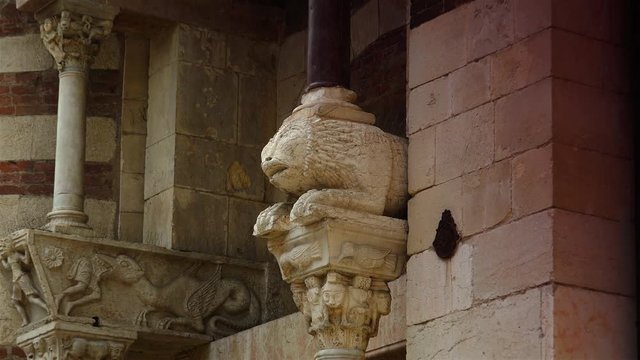 Detail of the lion and column in red marble of the Basilica of San Zeno in Verona Italy. Is considered one of the masterpieces of Romanesque architecture in Italy,ULTRA HD 4K, 