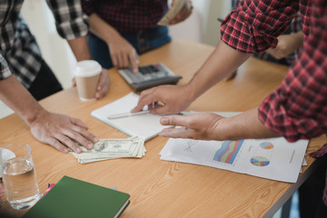 Hand of businessmen group discussing. They are business analyzing. brainstorming, teamwork, meeting concept.