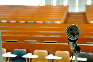 Microphone for speaker in classroom, lecture hall. Selective focus. copy space.