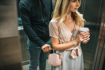 robbery pickpocketing smartphone from womans bag in elevator