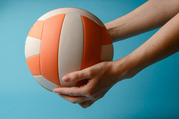 Volleyball in woman hands