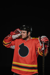 professional hockey player suffering from headache isolated on black