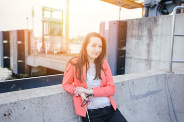 Young girl dressed in casual walking on a street