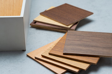 samples of material, wood , on concrete table.Interior design select material for idea.