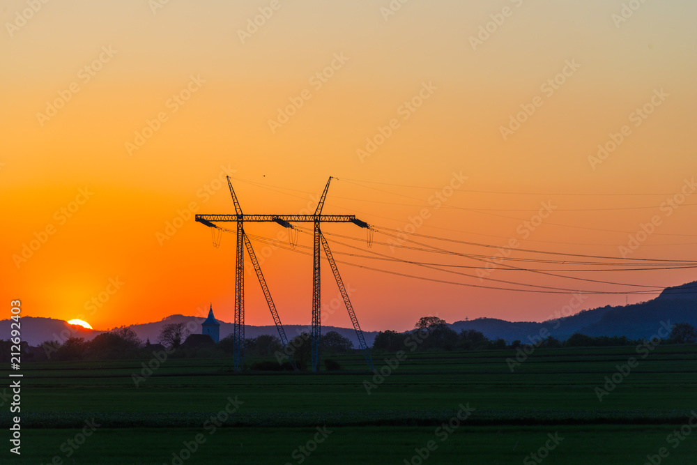 Poster electric pylon at the sunset