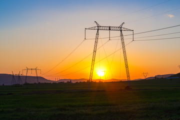 Fototapeta na wymiar Electric pylon at the sunset