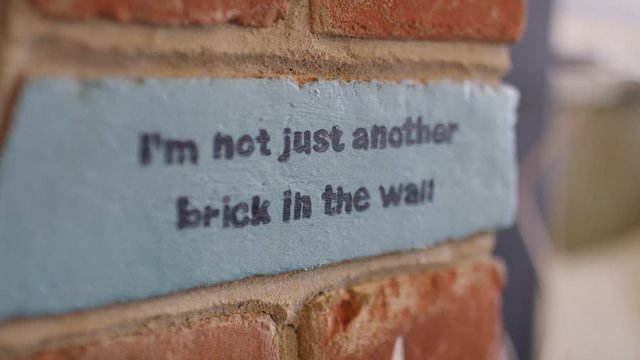 Abstract focus pull of a brick in a cafe, in slow motion