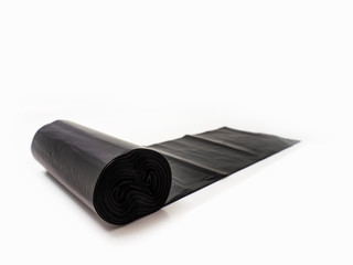 roll of garbage black bags isolated on white background