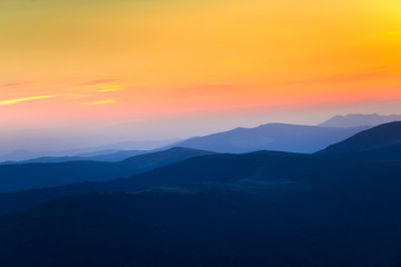 Naklejka na ściany i meble Mountains landscape at the sunset 