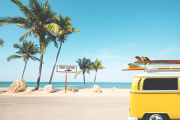 Vintage car with surfboard on roof on tropical beach in summer. beach sign for gone surfing....