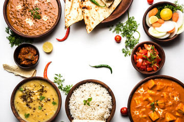 Assorted indian food for lunch or dinner, rice, lentils, paneer, dal makhani, naan, chutney, spices...