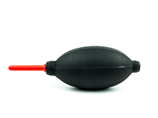 Black rubber blower pump for cleaning camera and lens on white background, photographer with equipment used to clean dust.