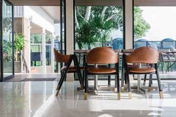 Tables and chairs in restaurant