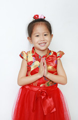 Smiling little Asian girl wearing red Cheongsam with Respect 