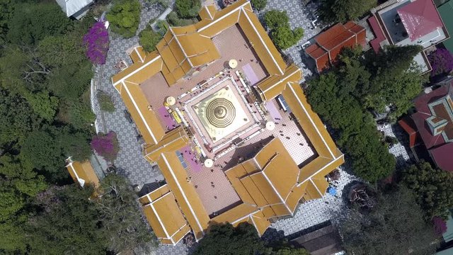 4K AERIAL OVERHEAD SHOT of Doi Suthep, buddhist temple in Chiang Mai, Thailand. Top Spinning View