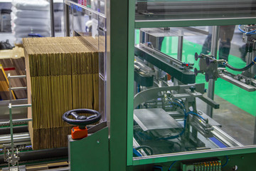 Automatic carton erector machine. Industrial warehouse machinery
