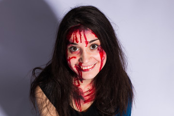 Bloody and scary looking zombie girl. Halloween concept