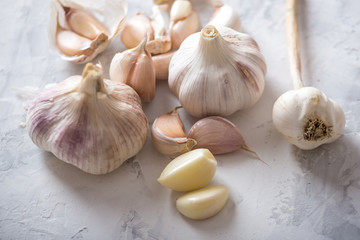 Group of garlic cloves scattered on a white background. Important ingredient in cuisines of the world. Healthy product.