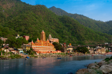 View of Ganga river embankment, Lakshman Jhula bridge and Tera Manzil Temple, Trimbakeshwar in Rishikesh