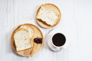 cup of black coffee with bread