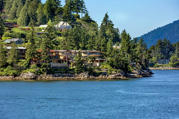 The village is on the shore of the bay on the wooded slope of the suburb of West Vancouver.  Horseshoe Bay   West Vancouver British Columbia, Canada.