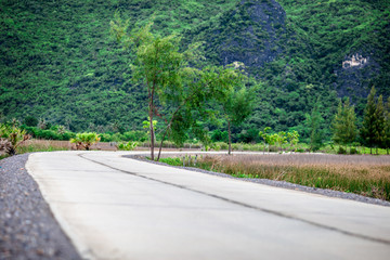 The road is surrounded by mountains. Beautiful on the go. It is a pleasure to travel one way.