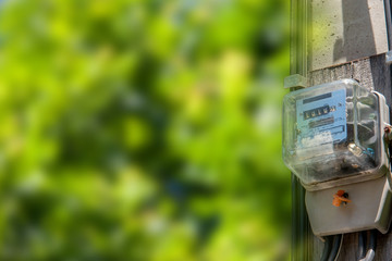 electric meters on sky background, natural sunset