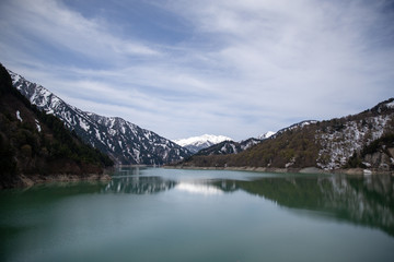Scenery of lake and mountains from Kurobe Dam in Tateyama Kurobe Alpine Route, Japan
