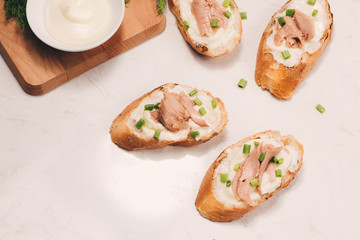Bruschetta. Sandwich tuna fish salad on wooden background