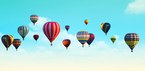 Hot air balloon over the pastel sky background.