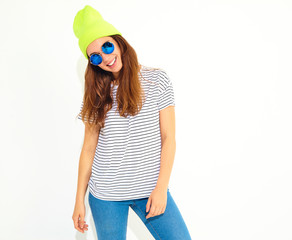 Portrait of young stylish girl model in casual summer clothes in yellow beanie hat. Isolated on...