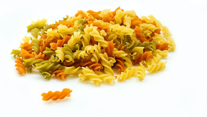 Multicolor raw pasta close-up isolated on white background. Food ingredient