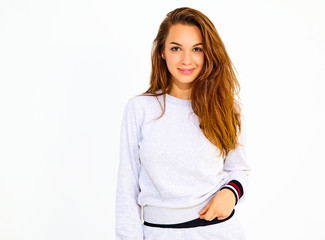 Portrait of young stylish cute girl model in casual gray sport costume with natural makeup isolated...
