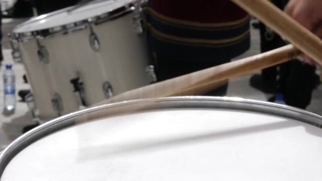 Close up drummer beating drum in a marching band