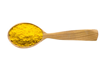 turmeric powder in wooden spoon isolated on white background. spice for cooking food, top view.