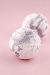 Lavender bath bombs on a gently pink background.Aromatherapy and body cosmetics.natural  organic body cosmetics