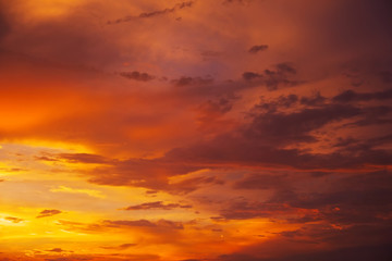 Beautiful bright colorful sky. Picture taken at sunset. Red-orange background with nice paints. Rare sunrise. Natural composition