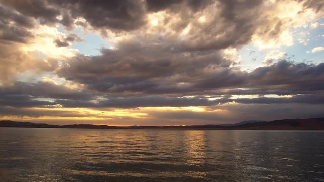 Utah Lake at sunset as you hear the waves ripple
