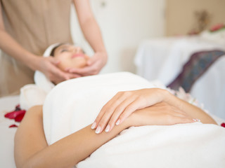 Fototapeta na wymiar Face Massage. Close-up of a Woman Getting Spa face Treatment.