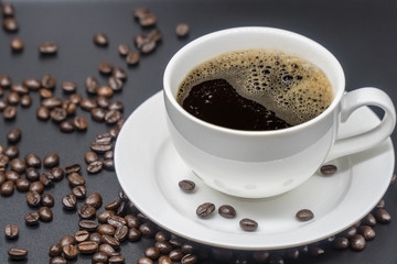 White cup of coffee on background