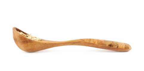 Wooden spoon of oatmeal flakes isolated
