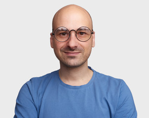 handsome bald man wearing spectacles