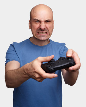 Middle Aged Man Playing Video Games.