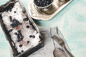 Berry crumble in the baking-Tin on the table