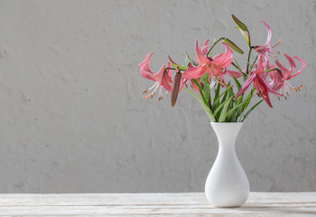 lily in vase on background white wall