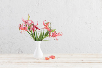 lily in vase on background white wall